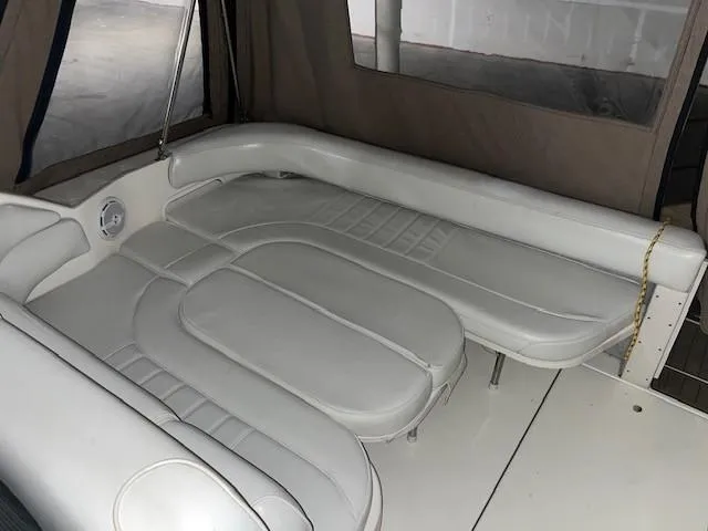 Slide: The Image of 1996 Sea Ray 290 Sundancer interior with white leather seating. - 6