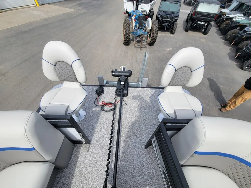 Slide: The Image of 2023 Angler Qwest 2285 Fish N Cruise boat interior with seating and equipment. - 15