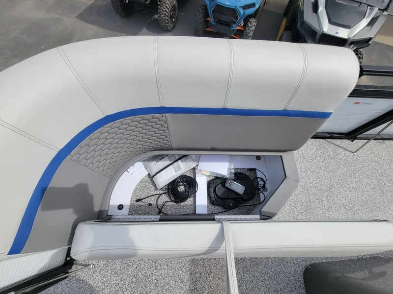 Slide: The Image of 2023 Angler Qwest 2285 Fish N Cruise boat seat storage with equipment and accessories. - 19