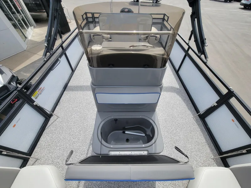 Slide: The Image of 2023 Angler Qwest 2285 Fish N Cruise boat interior with seating and storage. - 21