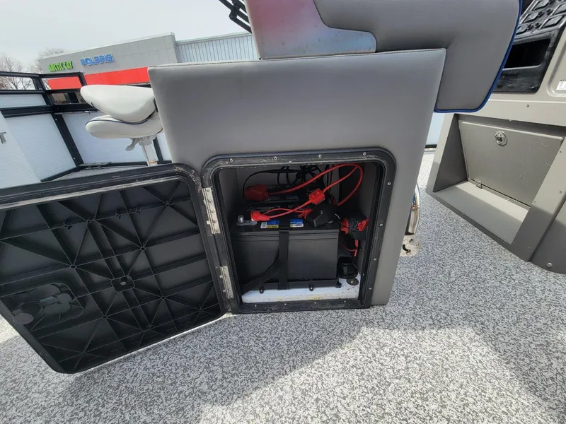 Slide: The Image of Open battery compartment of 2023 Angler Qwest 2285 FISH N CRUISE boat. - 25