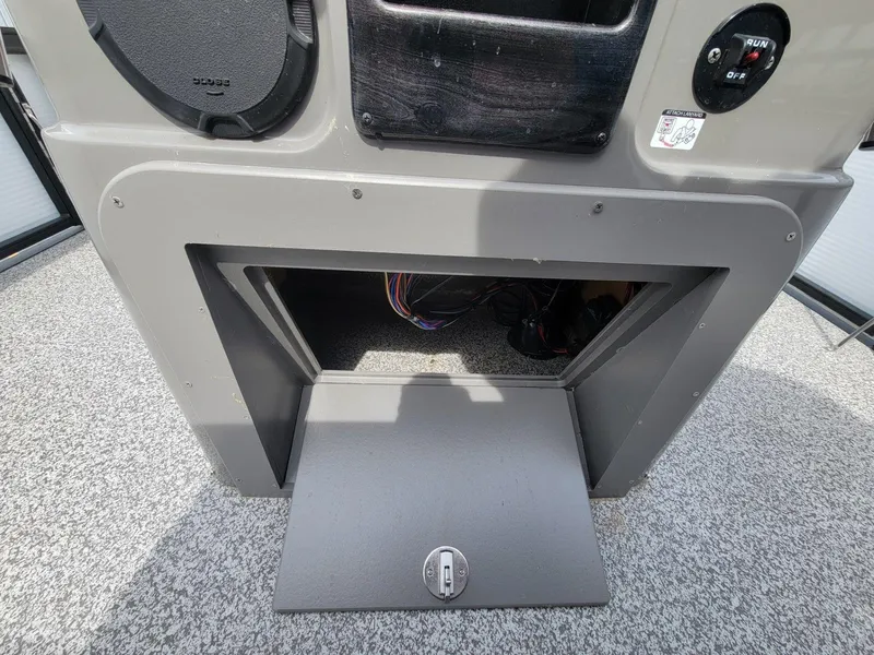 Slide: The Image of Open storage compartment on 2023 Angler Qwest 2285 Fish N Cruise boat. - 29