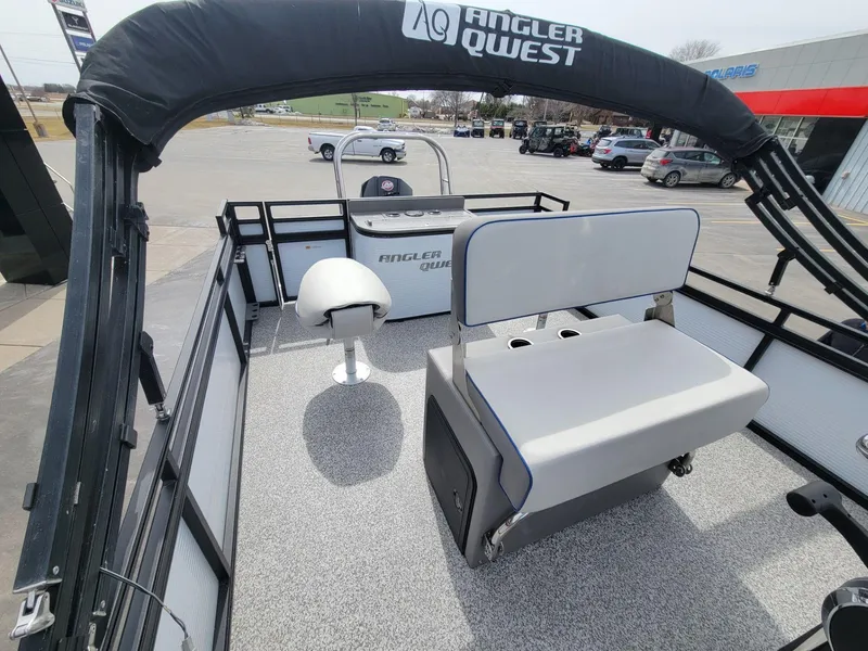 Slide: The Image of 2023 Angler Qwest 2285 Fish N Cruise boat interior with seating and helm. - 30