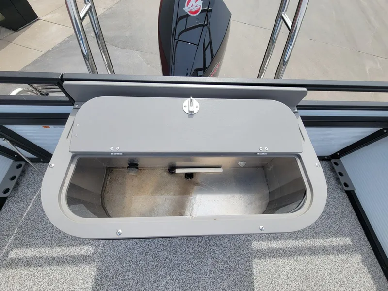 Slide: The Image of Open storage compartment on 2023 Angler Qwest 2285 Fish N Cruise boat. - 32