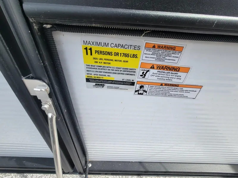 Slide: The Image of Capacity and warning labels on a 2023 Angler Qwest 2285 FISH N CRUISE boat. - 36