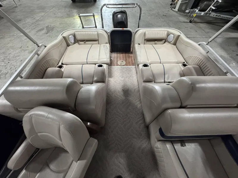 Slide: The Image of Interior of a 2012 Berkshire 223SLX STS pontoon boat with beige seating. - 4