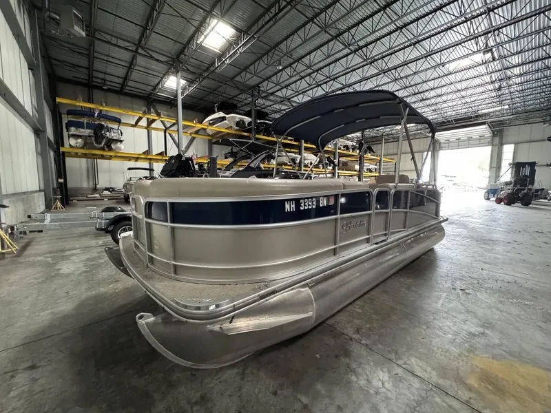 Slide: The Image of 2012 Berkshire 223SLX STS pontoon boat in a storage facility. - 5