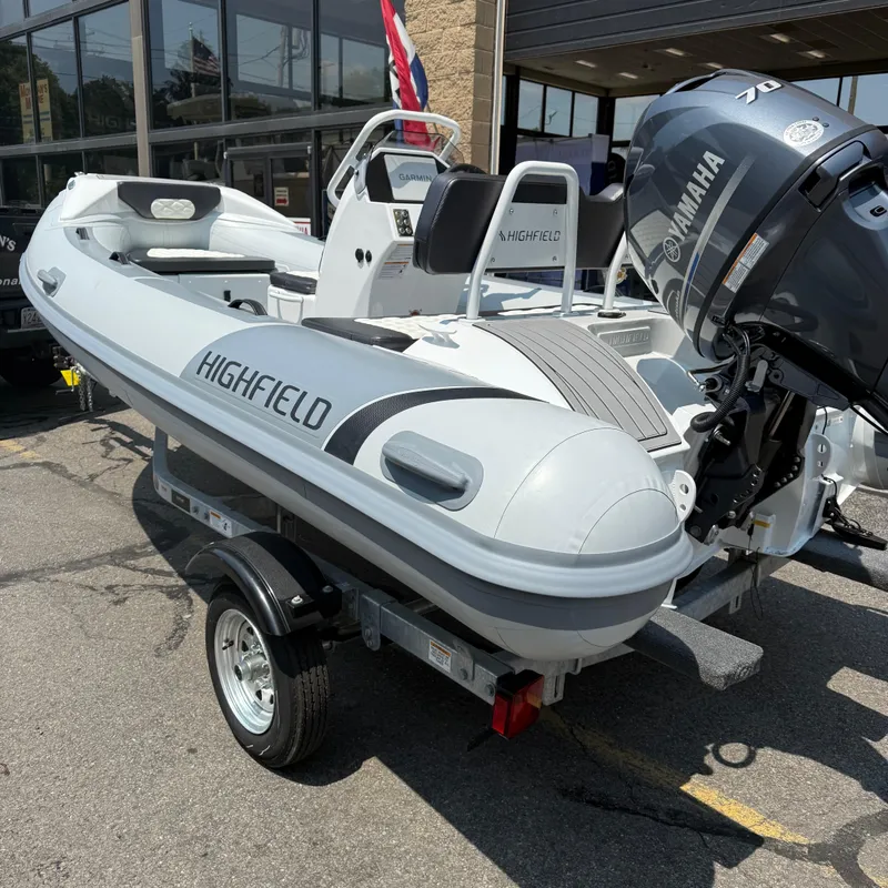 Slide: The Image of 2025 Highfield Sport 420 inflatable boat with Yamaha engine on a trailer. - 2