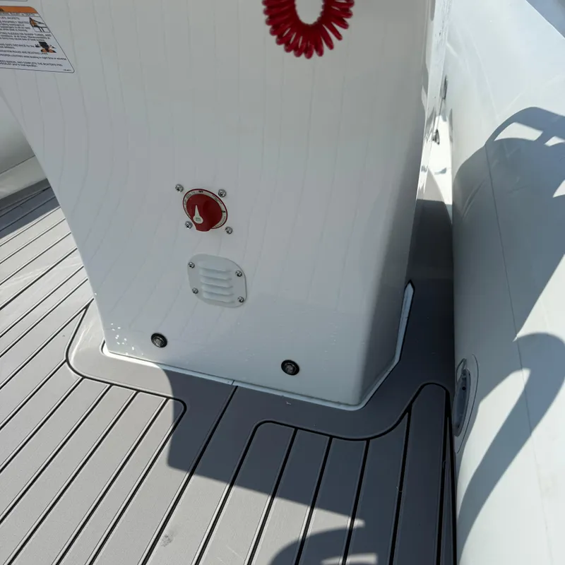 Slide: The Image of 2025 Highfield Sport 420 boat deck with control panel and red safety cord. - 5