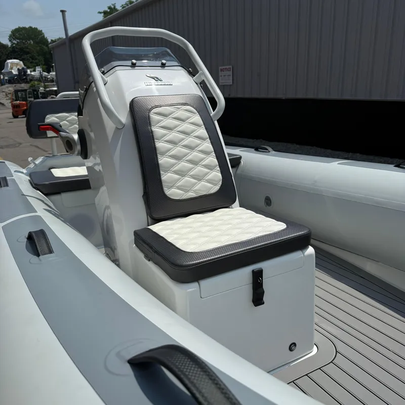 Slide: The Image of 2025 Highfield Sport 420 boat interior with cushioned seating and sleek design. - 7