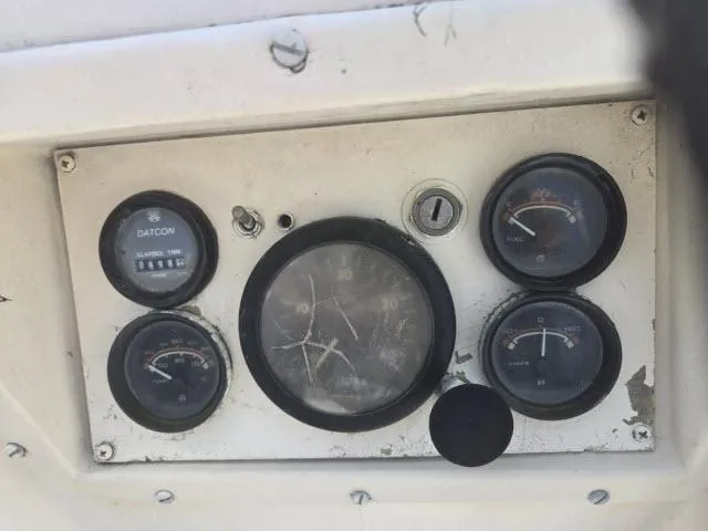 Slide: The Image of Control panel of a 1984 Newport 33 boat with various gauges and dials. - 9