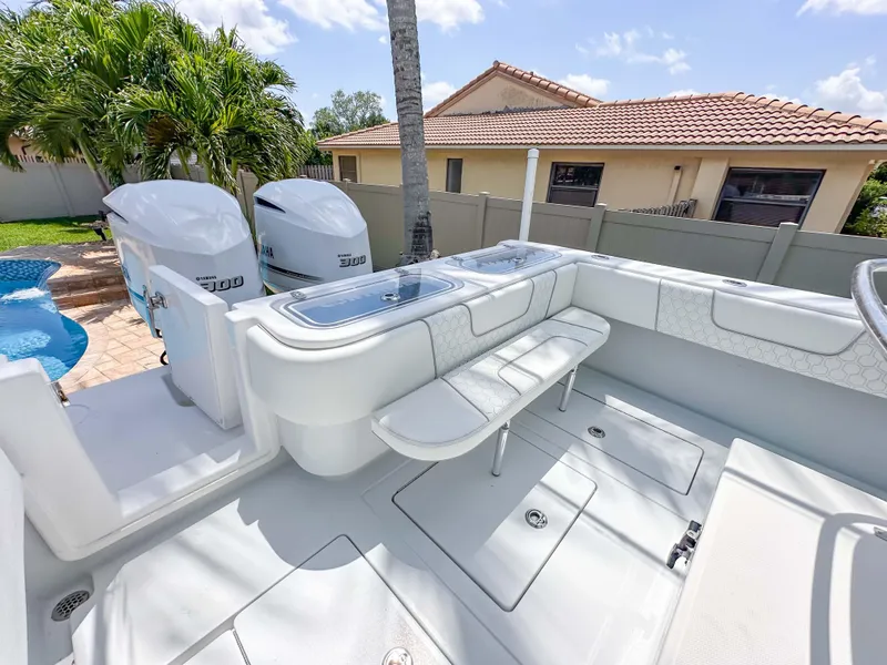 Slide: The Image of 2021 Contender 30 Tournament boat with dual engines, spacious deck, and seating area. - 15