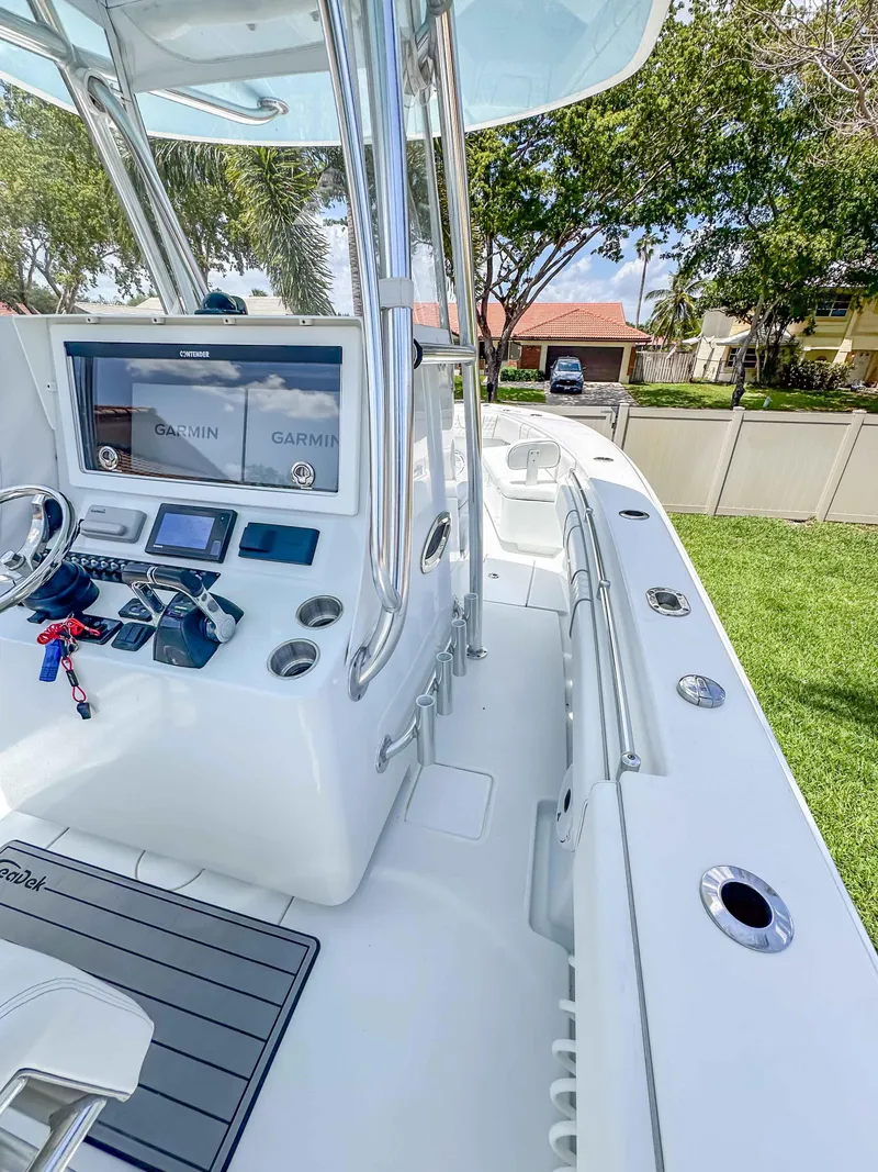 Slide: The Image of 2021 Contender 30 Tournament boat with advanced navigation system and sleek design. - 16