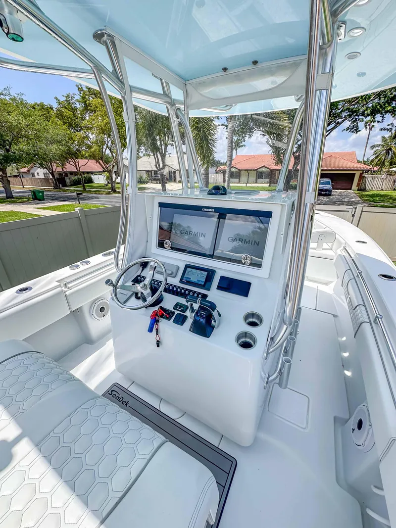 Slide: The Image of 2021 Contender 30 Tournament boat cockpit with advanced navigation systems and sleek design. - 17