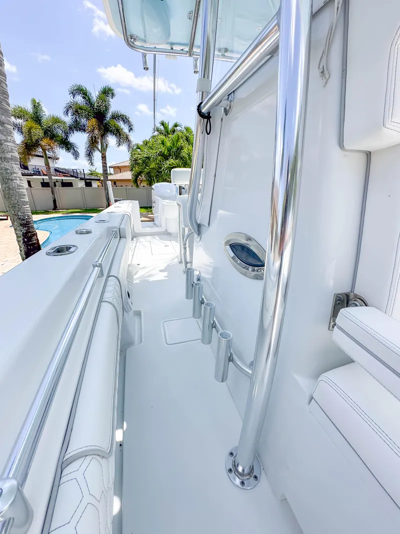 Slide: The Image of 2021 Contender 30 Tournament boat with sleek white interior and chrome details. - 19