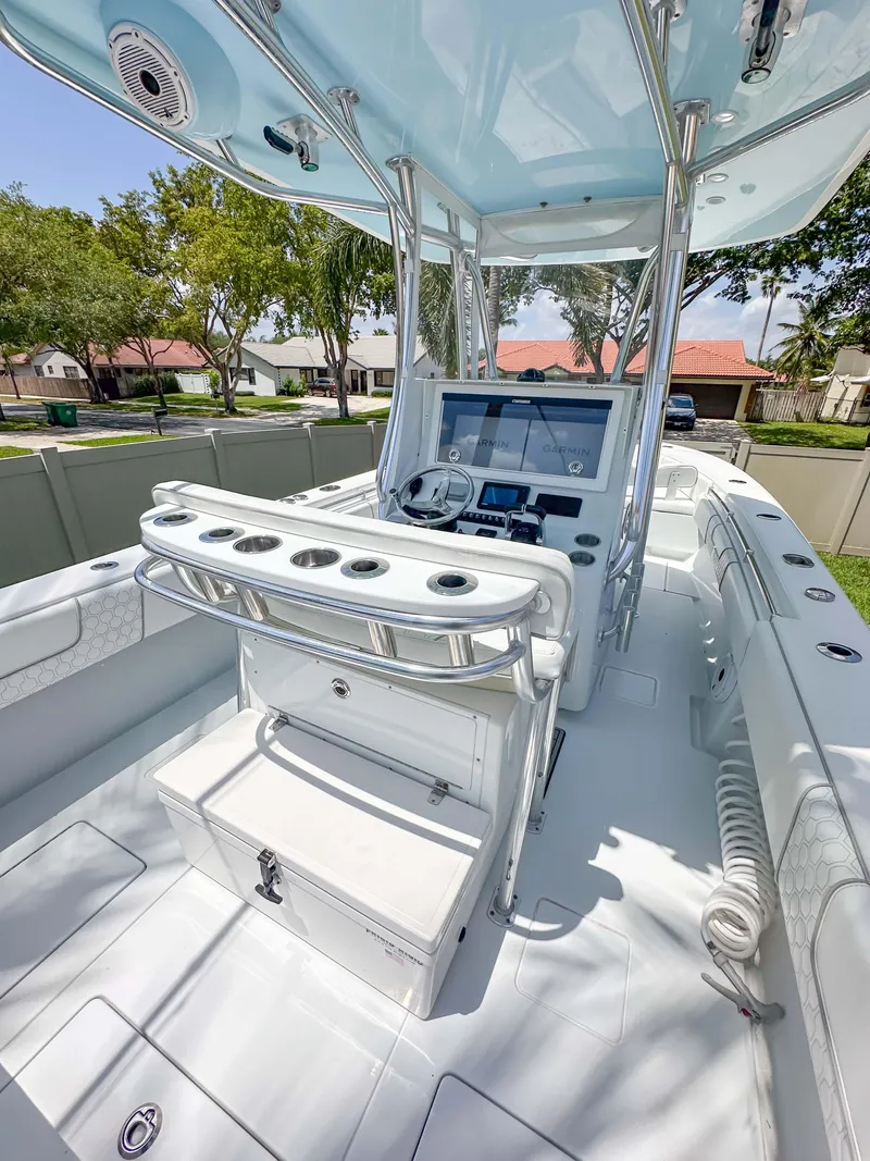 Slide: The Image of 2021 Contender 30 Tournament boat interior with modern console and seating. - 27