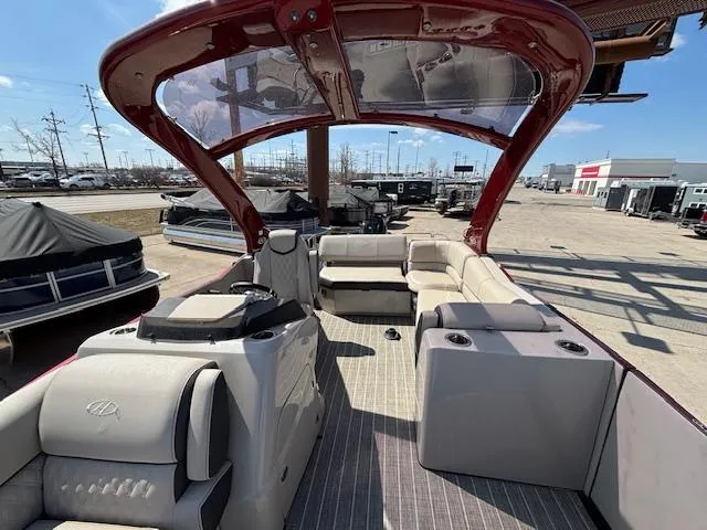 Slide: The Image of 2018 Harris Crowne SL 250 pontoon boat with spacious seating and modern design. - 12
