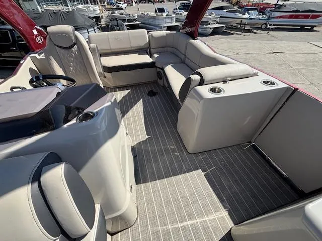 Slide: The Image of 2018 Harris Crowne SL 250 boat interior with plush seating and modern design. - 17