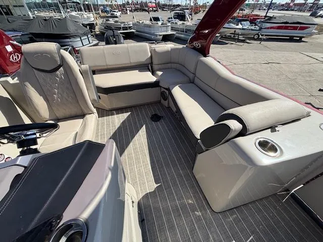 Slide: The Image of 2018 Harris Crowne SL 250 boat interior with spacious seating and modern design. - 18