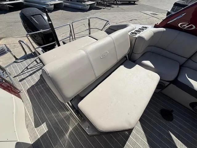 Slide: The Image of 2018 Harris Crowne SL 250 boat interior with adjustable seating and cup holders. - 22