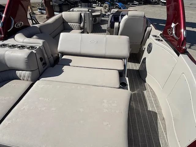 Slide: The Image of 2018 Harris Crowne SL 250 boat interior with luxurious seating and cup holders. - 28