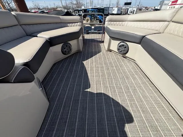Slide: The Image of 2018 Harris Crowne SL 250 boat interior with cushioned seating and speakers. - 41