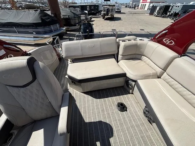 Slide: The Image of 2018 Harris Crowne SL 250 pontoon boat with luxurious beige seating and spacious deck. - 47