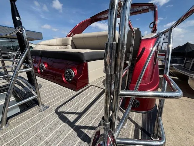 Slide: The Image of 2018 Harris Crowne SL 250 pontoon boat with red exterior and beige seating. - 6