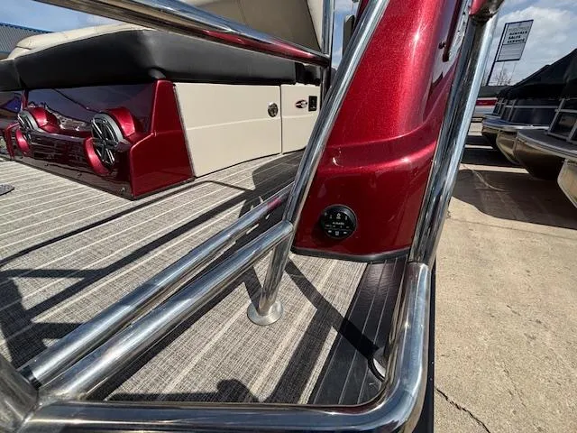 Slide: The Image of 2018 Harris Crowne SL 250 boat with red exterior and stainless steel railings. - 7