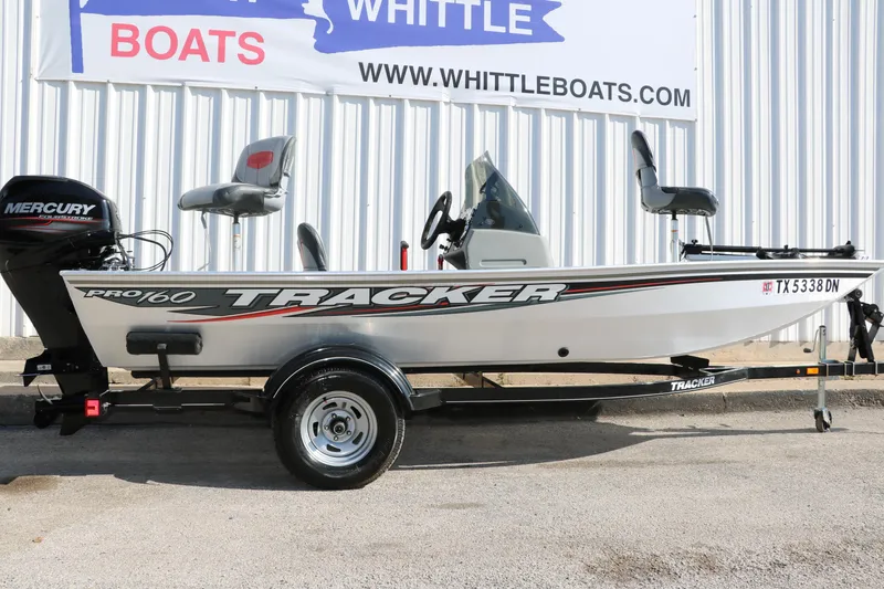 Slide: The Image of 2016 Tracker Pro 160 boat on trailer, displayed at Whittle Boats dealership. - 11