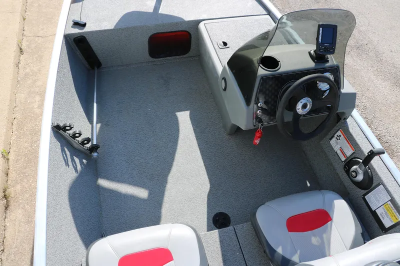 Slide: The Image of 2016 Tracker Pro 160 boat interior with steering console and seating. - 17