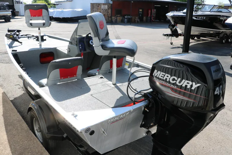 Slide: The Image of 2016 Tracker Pro 160 boat with Mercury 40 HP engine, featuring seating and storage. - 5