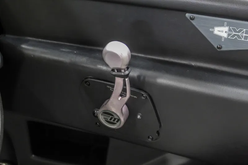 Slide: The Image of 2018 Axis A22 interior detail showing a control lever on the dashboard. - 16