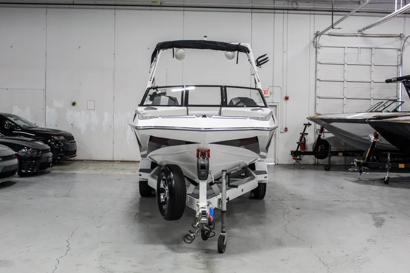 Slide: The Image of 2018 Axis A22 boat on trailer in indoor storage facility. - 3