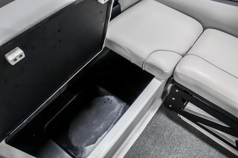 Slide: The Image of 2018 Axis A22 boat interior storage compartment with cushioned seating. - 30