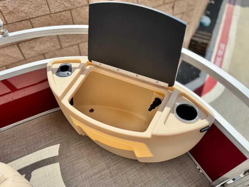 Slide: The Image of 2019 Sun Tracker Fishin' Barge 24 DLX livewell with cup holders and storage compartment. - 13