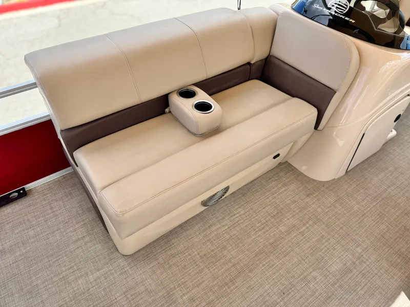 Slide: The Image of 2019 Sun Tracker Fishin' Barge 24 DLX boat seating with cup holders, beige upholstery. - 17