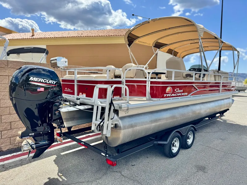 Slide: The Image of 2019 Sun Tracker Fishin' Barge 24 DLX pontoon boat with Mercury engine on trailer. - 6