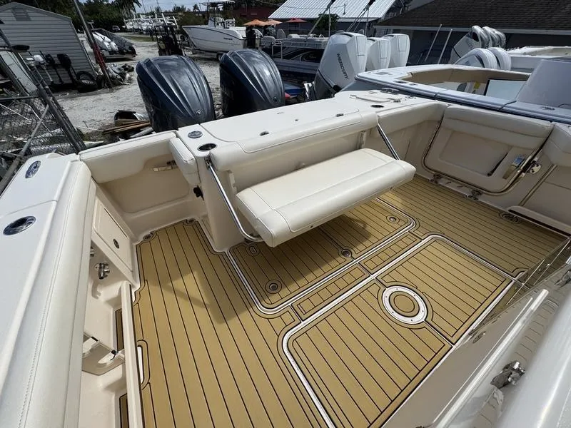 Slide: The Image of 2021 Grady-White Canyon 326 boat with spacious deck and foldable seating. - 25