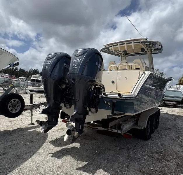Slide: The Image of 2021 Grady-White Canyon 326 boat with twin Yamaha 300 V6 engines on a trailer. - 5