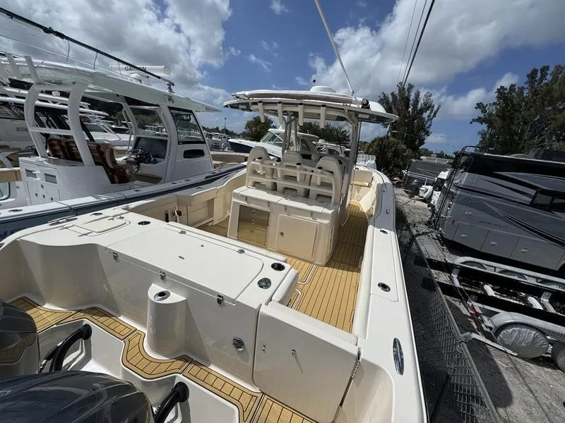 Slide: The Image of 2021 Grady-White Canyon 326 boat with spacious deck and modern design. - 7