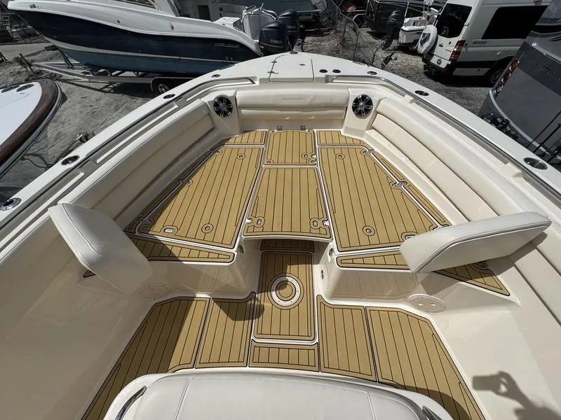 Slide: The Image of 2021 Grady-White Canyon 326 boat deck with teak flooring and seating. - 8