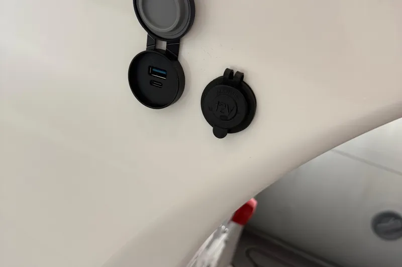 Slide: The Image of 2025 Highfield Sport 460 USB and 12V charging ports on white surface. - 12