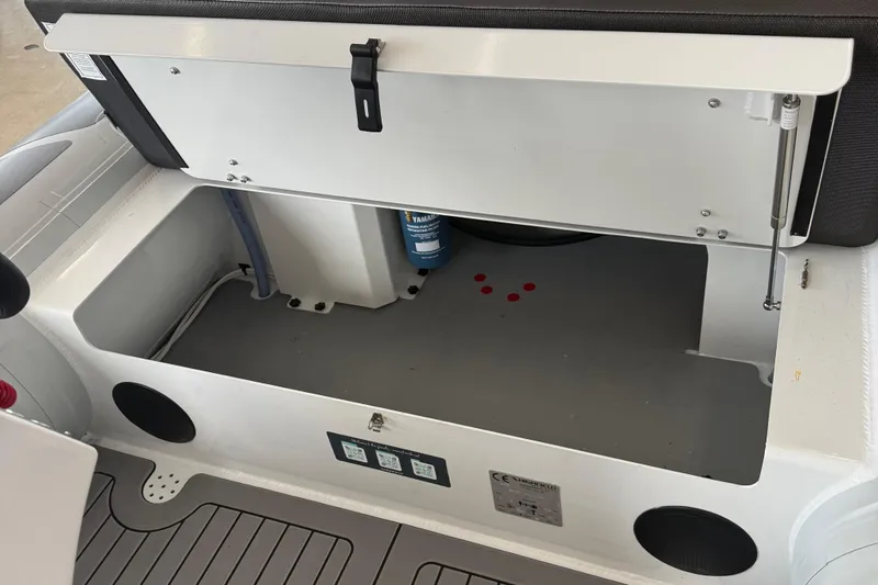 Slide: The Image of Open storage compartment in 2025 Highfield Sport 460 boat, showcasing interior space and equipment. - 13