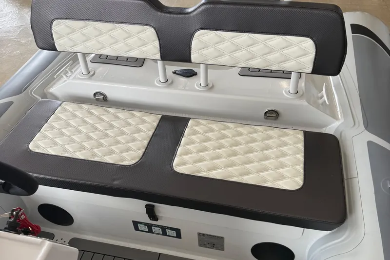 Slide: The Image of 2025 Highfield Sport 460 boat seat with diamond-stitched upholstery, featuring elegant design and comfort. - 14