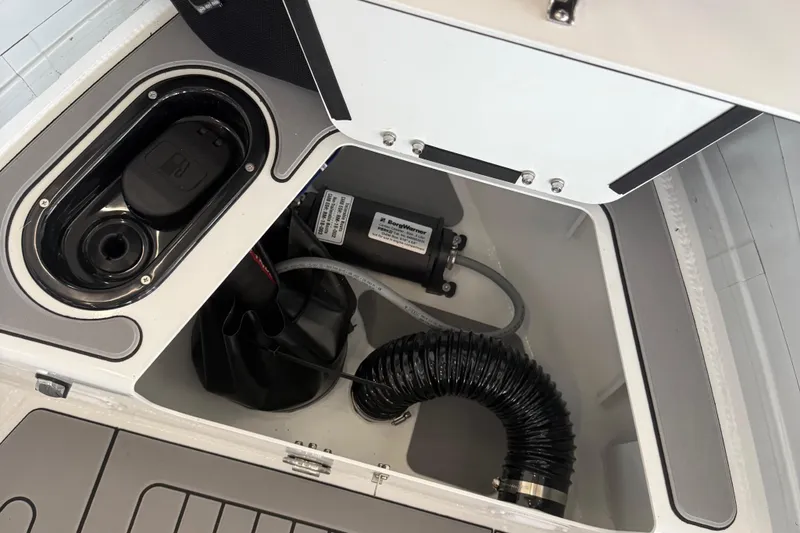 Slide: The Image of Interior view of 2025 Highfield Sport 460 boat compartment with equipment and storage. - 17