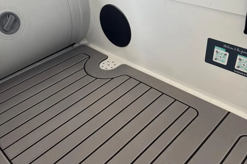 Slide: The Image of 2025 Highfield Sport 460 boat interior with sleek flooring and QR code details. - 20