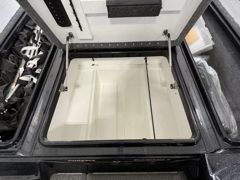 Slide: The Image of Open storage compartment of 2021 Phoenix 721 ProXP boat, showcasing interior space. - 11