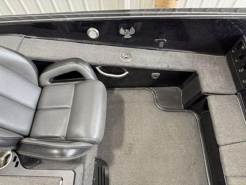 Slide: The Image of 2021 Phoenix 721 ProXP boat interior with gray seating and carpeted flooring. - 12