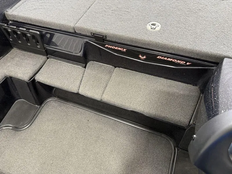 Slide: The Image of Interior of 2021 Phoenix 721 ProXP boat with cushioned seating and storage compartments. - 13
